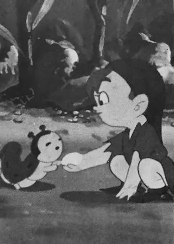 A black and white cartoon image. A small boy crouches, and passes food to a caterpillar, in front of a forest background.